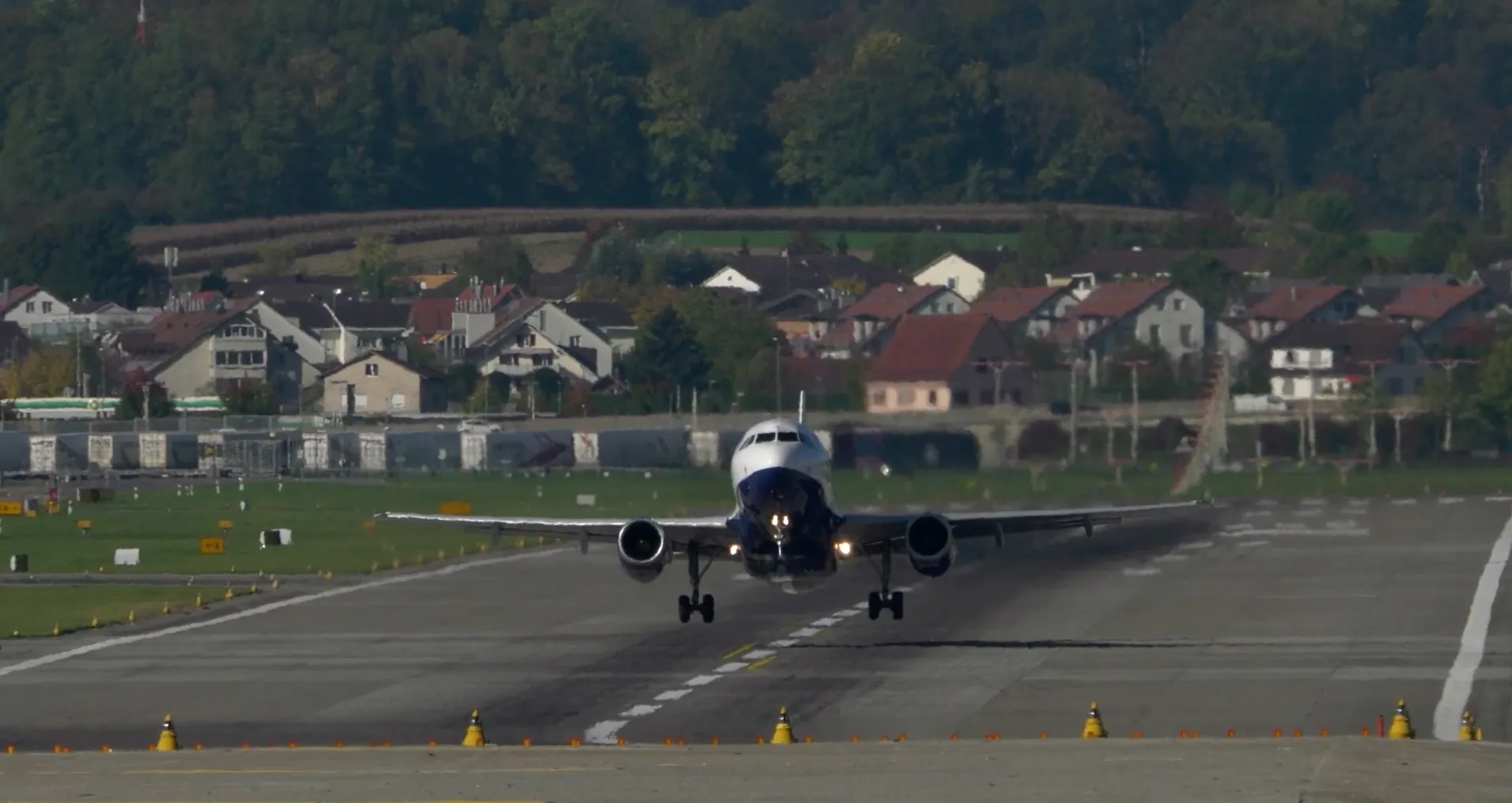 An airliner lifting off the runway.