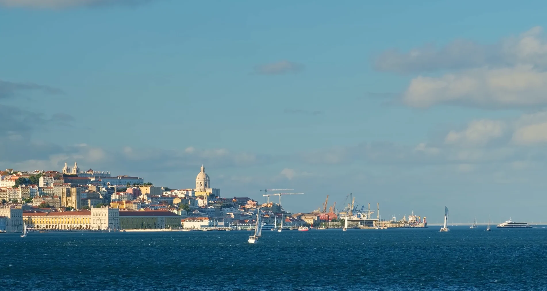 Lisbon waterfront seen across the Tagus River.